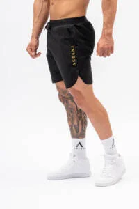Male model wearing VELOCE Black Shorts — gym to lifestyle