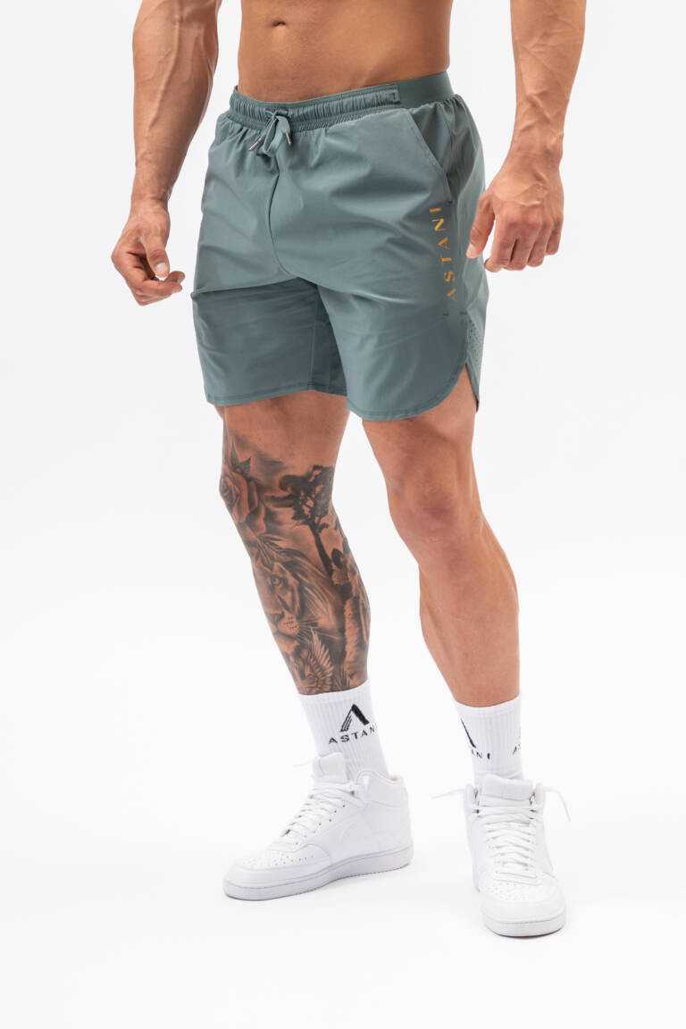 Men's VELOCE Shorts green — front view, athletic fit